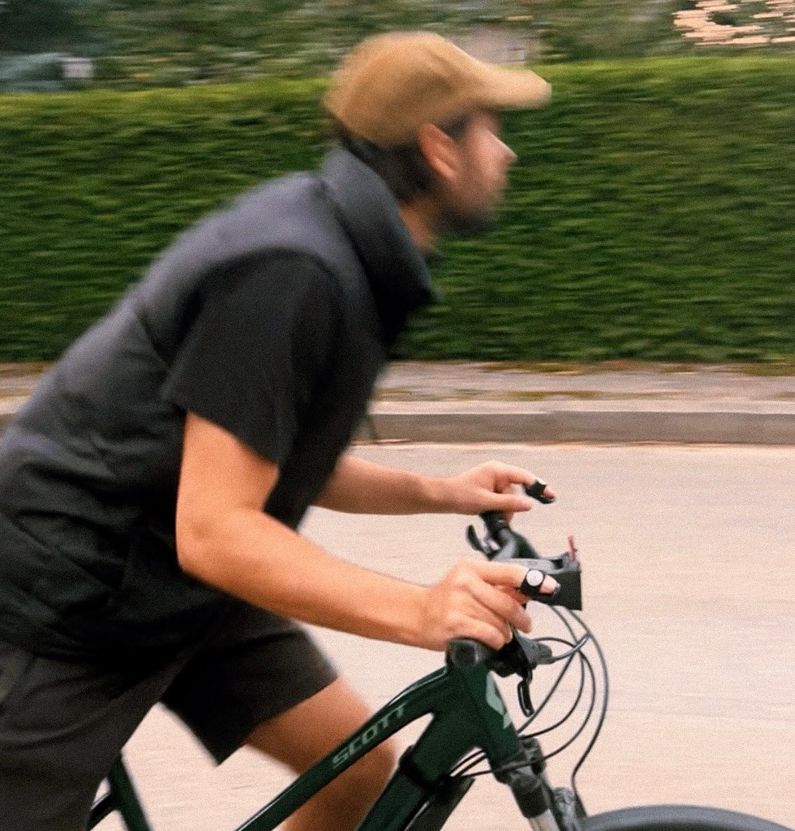 Young boy creating beats while riding bike